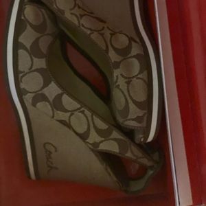 I’m selling a nice pair of Coach Wedge Sandals